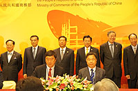 Prof. Joseph Sung (left, front row), Vice-Chancellor of CUHK and Prof. Yang Huanming (right, front row), President of BGI sign the MOU on clinical genomic collaboration under the witness of Mr. Li Keqiang (2nd from left, back row), Vice-Premier of the State Council